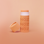 Load image into Gallery viewer, Reef-safe and cruelty-free Noz sunscreen zinc stick in neon pastel orange
